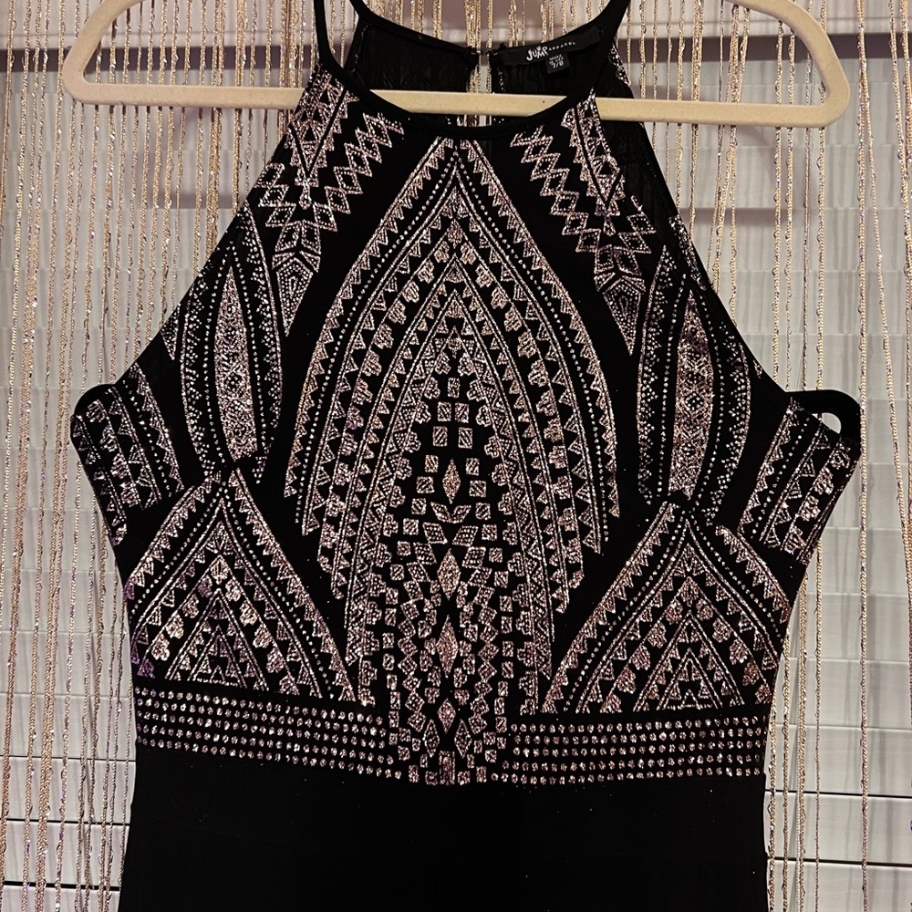 Jump Apparel jumpsuit size 7/8. Aztec design in gold on a black background
